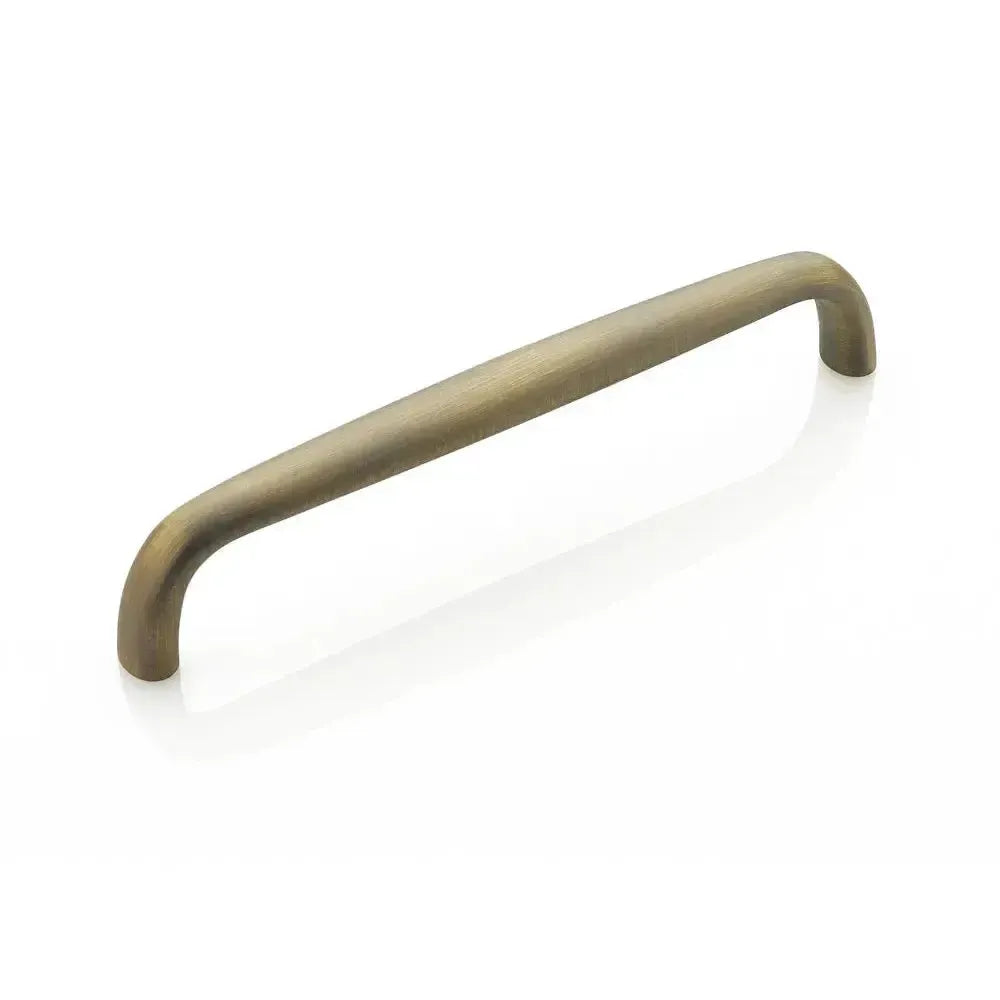 The Schaub Traditional Cabinet Pull in Antique Light Brass finish.