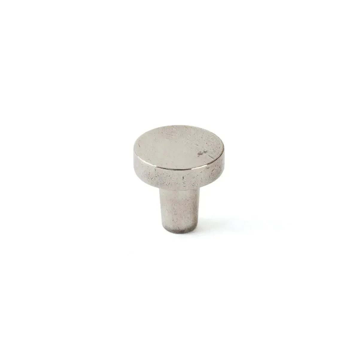 The Schaub Turno Round Cabinet Knob in Polished White Bronze finish.