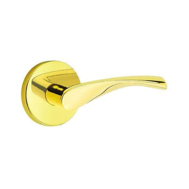 The Emtek Triton Lever With Disk Rosette in Unlacquered Brass finish